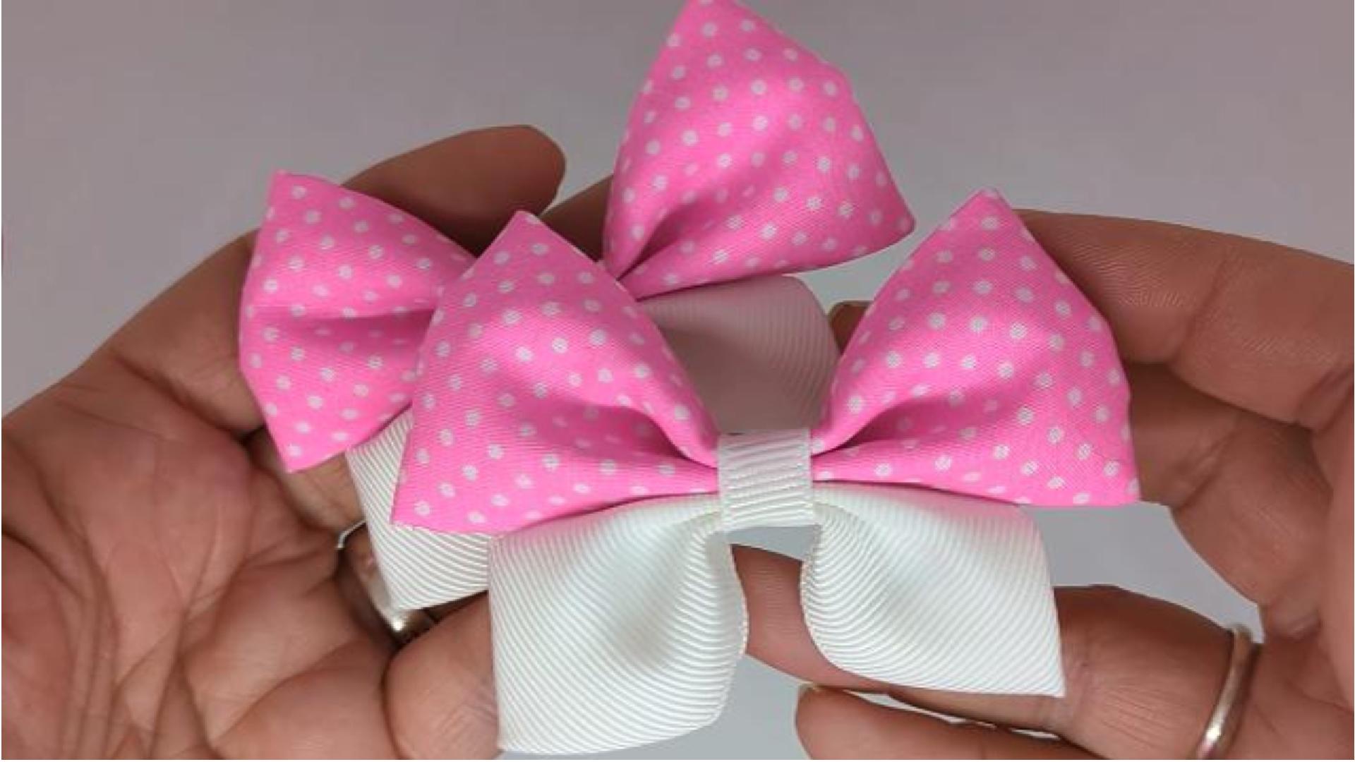 Close-up of hot pink and white polka dot hair bows on alligator clips, measuring 8cm x 6cm, showcasing the playful polka dot design on cotton fabric and grosgrain ribbon.