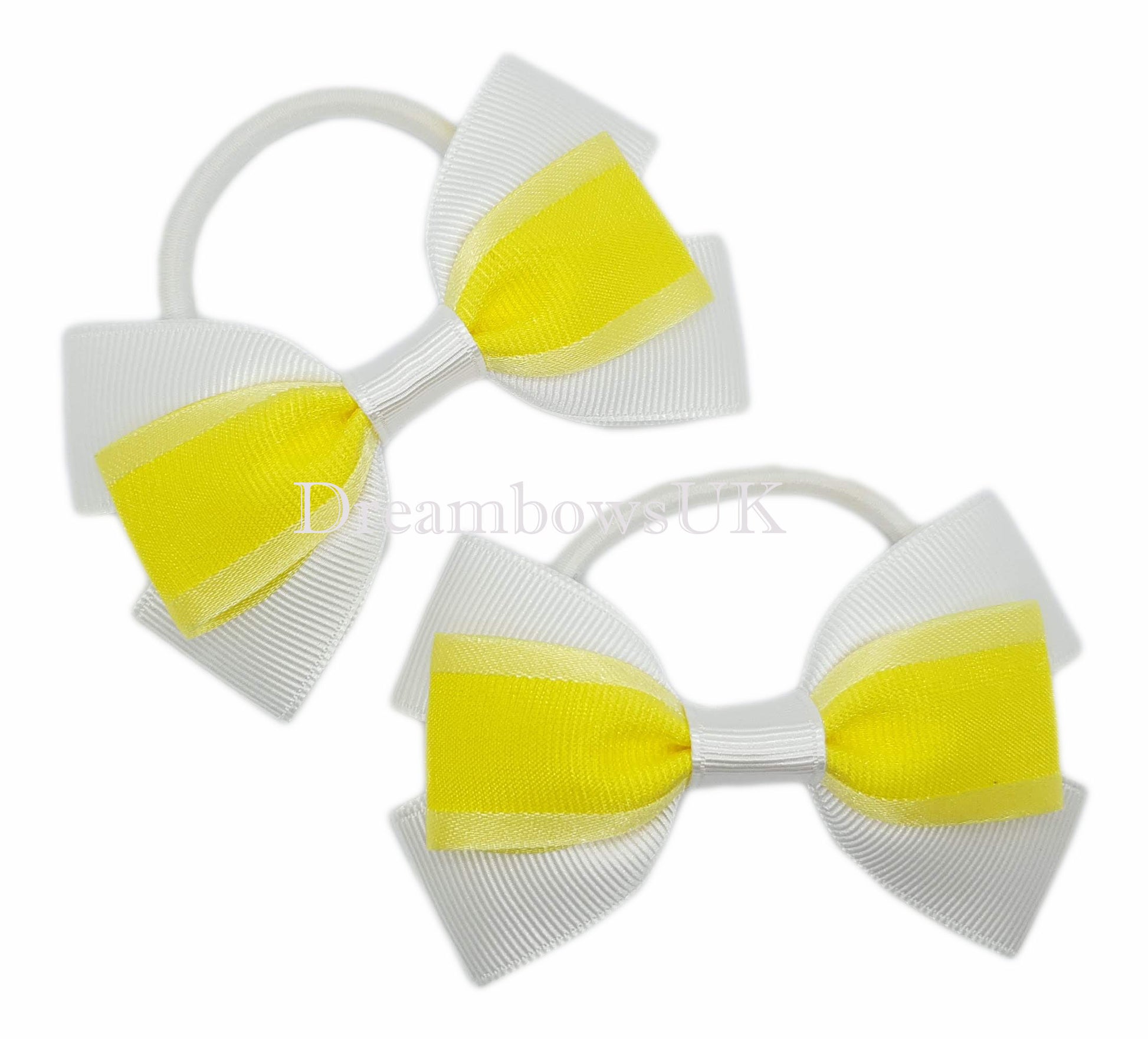 Yellow and white hair bows on thick bobbles