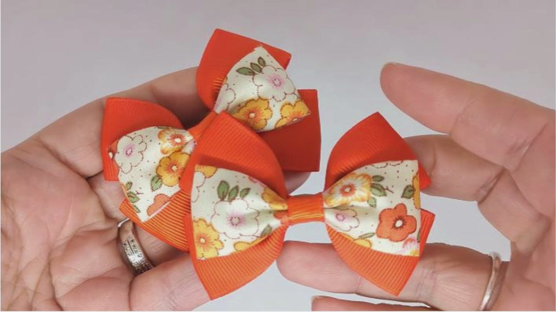 Orange floral hair bows on alligator clips